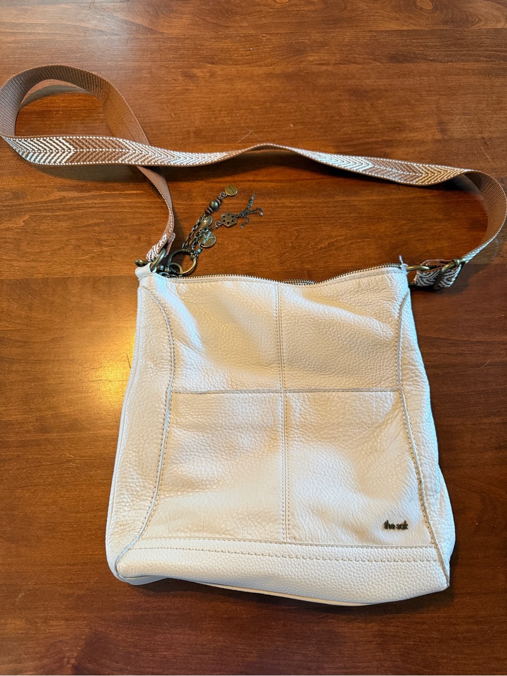 The Sak Cream Pebbled Leather Crossbody with Woven Strap